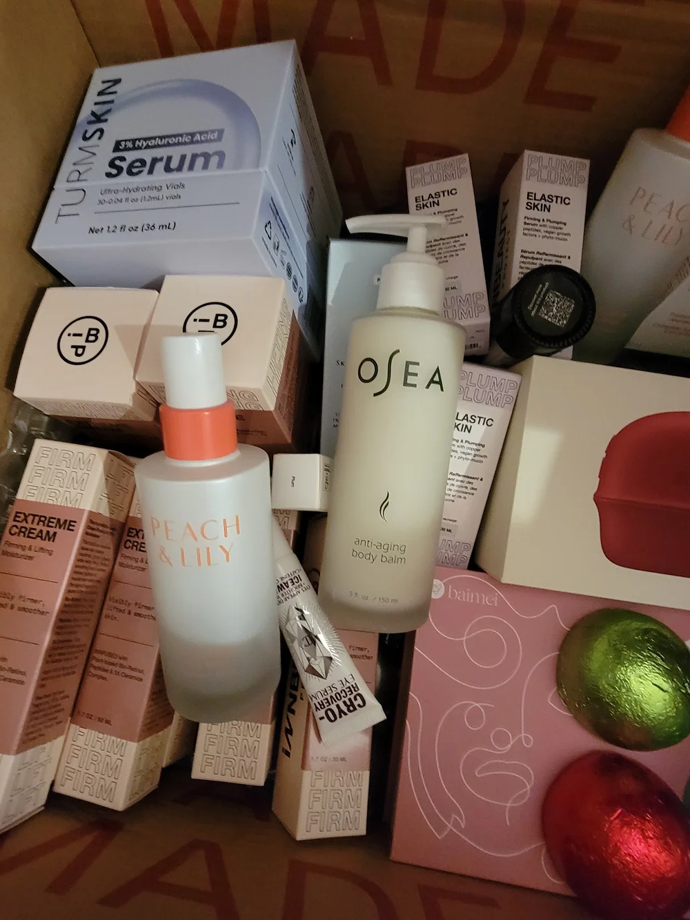 A Box Full Of Many High End Facial Items & Women's 8 Piece White Makeup Brushes